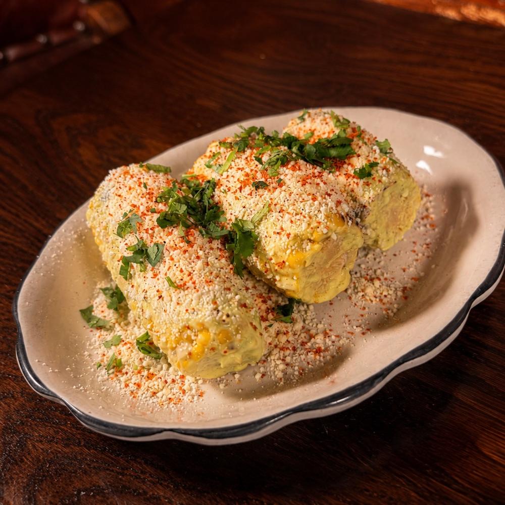 Grilled elote with cilantro aioli, cotija and tajin