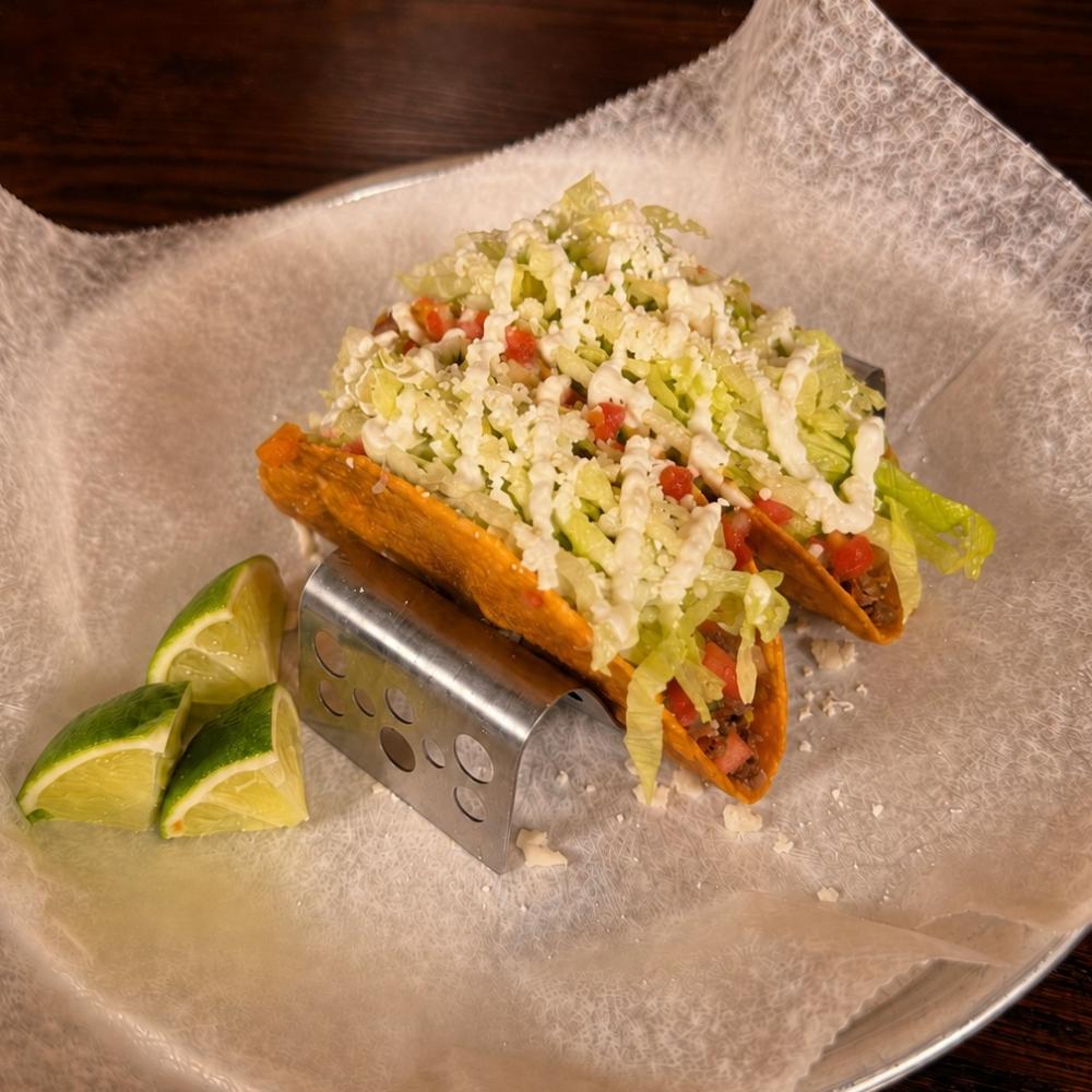 Old Style tacos with ground beef, lettuce, pico de gallo and queso fresco