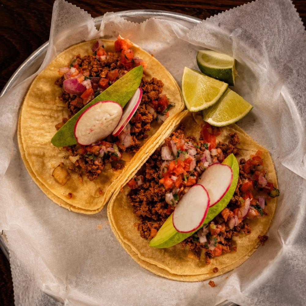 Vegan chorizo tacos with potatoes, pico de gallo, avocado and radish